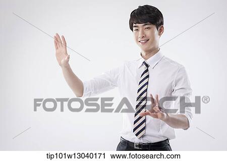 Stock Image - a business man posing. Fotosearch