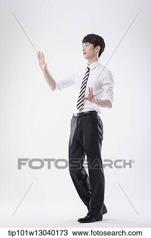 Stock Image - a business man posing. Fotosearch