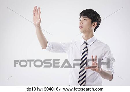 Stock Photo - a business man posing. Fotosearch