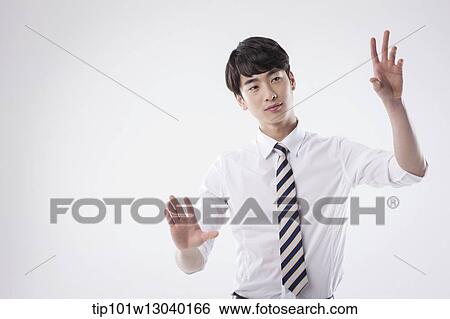 Stock Photograph - a business man posing. Fotosearch