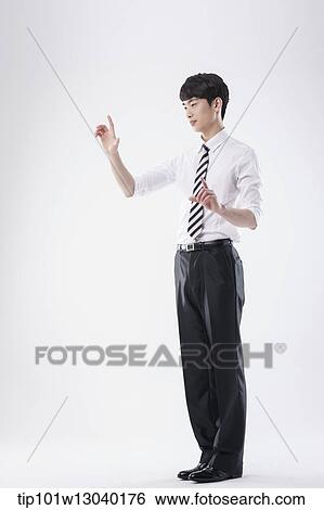 Stock Photograph - a business man posing. Fotosearch