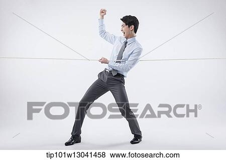 a business man pulling a wire View Large Photo Image Stock Photo - a business man pulling a wire. Fotosearch