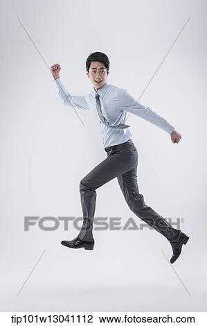 Stock Image - a business man running. Fotosearch