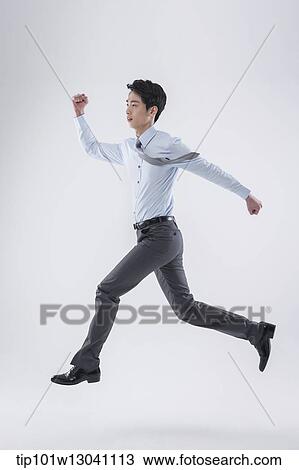 Stock Image - a business man running. Fotosearch