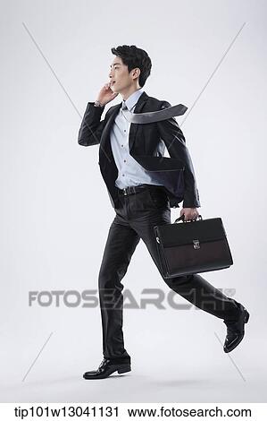 Stock Image - a business man running. Fotosearch