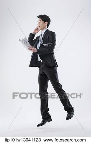 Stock Photo - a business man running. Fotosearch
