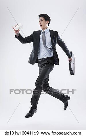 Stock Photo - a business man running. Fotosearch