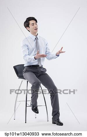 a business man sitting on a chair View Large Photo Image Stock Image - a business man sitting on a chair. Fotosearch