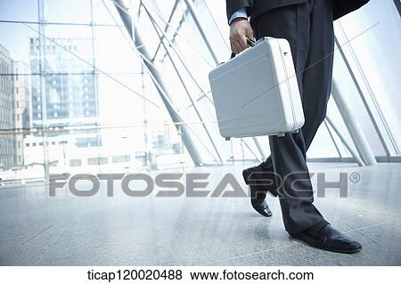 a business man walking View Large Photo Image Stock Photo - a business man walking. Fotosearch