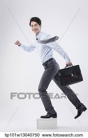 a business man with a case View Large Photo Image Stock Image - a business man with a case. Fotosearch