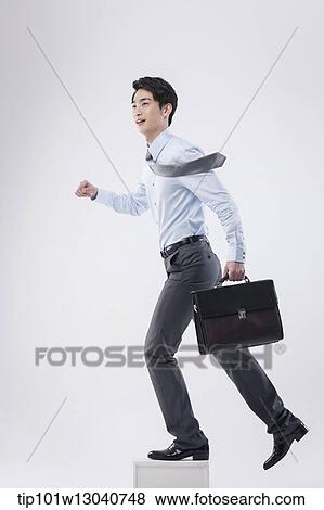 a business man with a case View Large Photo Image Stock Photo - a business man with a case. Fotosearch
