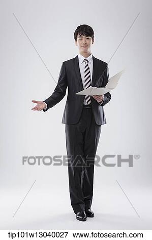 Stock Photo - a business man with a folder. Fotosearch