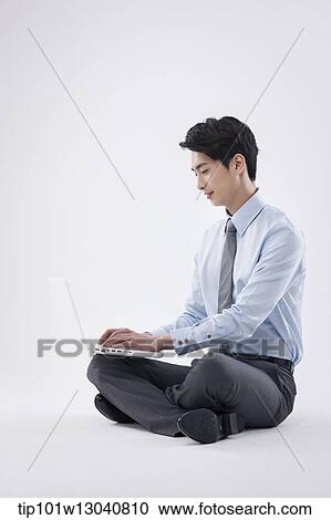 a business man with a laptop View Large Photo Image Stock Image - a business man with a laptop. Fotosearch
