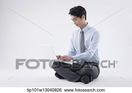 a business man with a laptop View Large Photo Image Stock Photograph - a business man with a laptop. Fotosearch