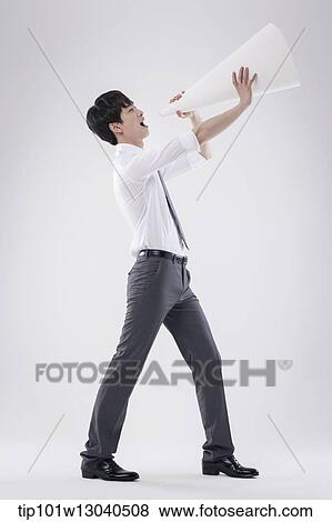 a business man with a paper megaphone View Large Photo Image Stock Photo - a business man with a paper megaphone. Fotosearch