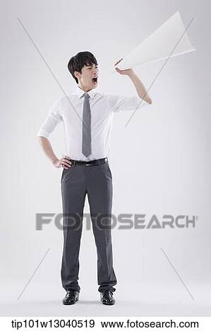 Stock Photo - a business man with a paper megaphone. Fotosearch