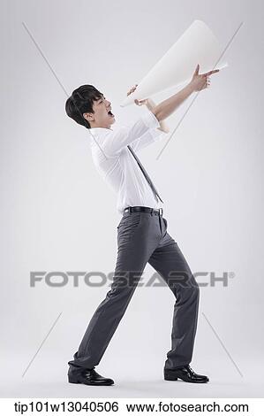 a business man with a paper megaphone View Large Photo Image Stock Photograph - a business man with a paper megaphone. Fotosearch