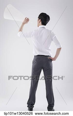 a business man with a paper megaphone View Large Photo Image Stock Photograph - a business man with a paper megaphone. Fotosearch