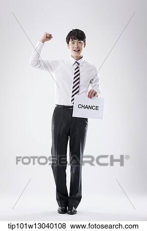 Stock Photo - a business man with a paper saying change. Fotosearch