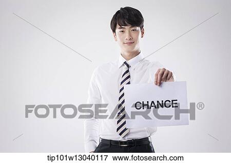 a business man with a paper saying change View Large Photo Image Stock Photo - a business man with a paper saying change. Fotosearch