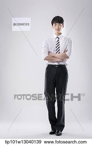 Stock Photo - a business man with a paper saying business. Fotosearch
