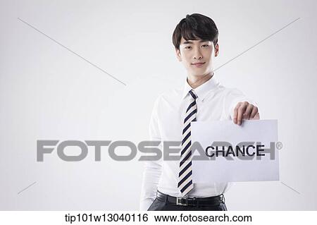 a business man with a paper saying change View Large Photo Image Stock Photograph - a business man with a paper saying change. Fotosearch