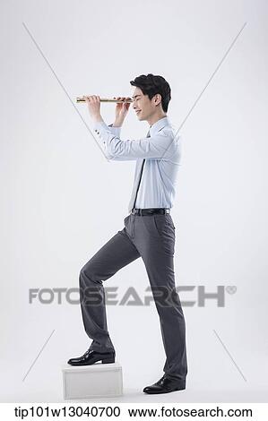 a business man with a telescope View Large Photo Image Stock Image - a business man with a telescope. Fotosearch