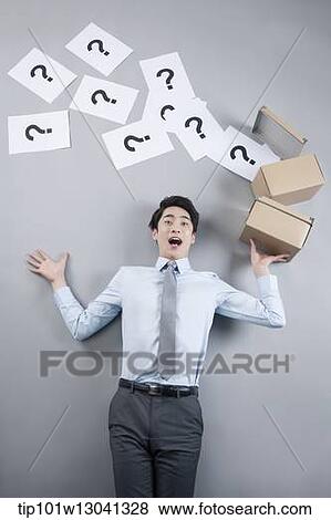 a business man with papers that has a question mark View Large Photo Image Stock Photo - a business man with papers that has a question mark. Fotosearch