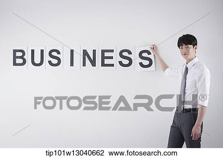 Stock Image - a business man with the word business. Fotosearch