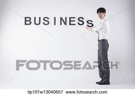 a business man with the word business View Large Photo Image Stock Photo - a business man with the word business. Fotosearch