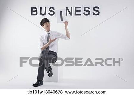 a business man with the word business View Large Photo Image Stock Photo - a business man with the word business. Fotosearch