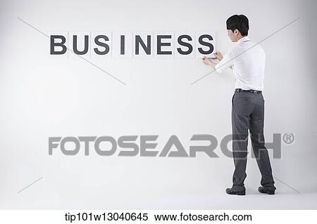 Stock Photography - a business man with the word business. Fotosearch
