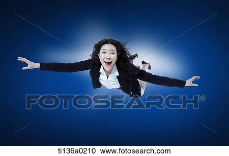 a business woman flying View Large Photo Image Stock Image - a business woman flying. Fotosearch