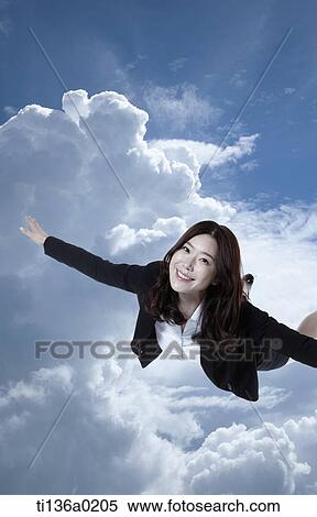 Stock Photography - a business woman flying. Fotosearch