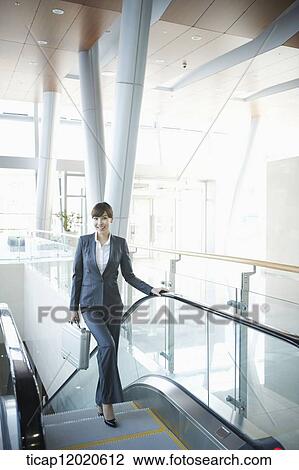 a business woman going up the stairs View Large Photo Image Stock Image - a business woman going up the stairs. Fotosearch