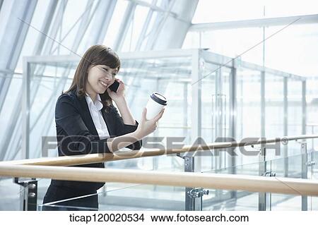 a business woman with a coffee View Large Photo Image Picture - a business woman with a coffee. Fotosearch