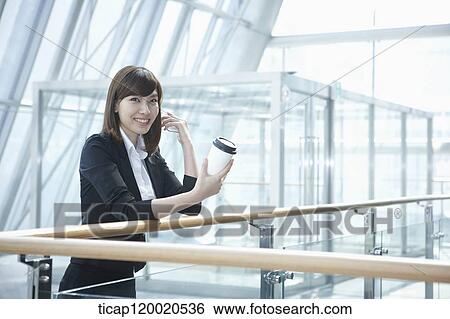 a business woman with a coffee View Large Photo Image Stock Photograph - a business woman with a coffee. Fotosearch