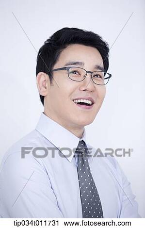 Stock Image - a businessman drinking cup of coffee. Fotosearch