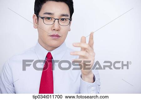 a businessman in business suit explaining using hand gesture View Large Photo Image Stock Image - a businessman in business suit explaining using hand gesture. Fotosearch