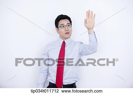 a businessman in business suit explaining using hand gesture View Large Photo Image Stock Image - a businessman in business suit explaining using hand gesture. Fotosearch
