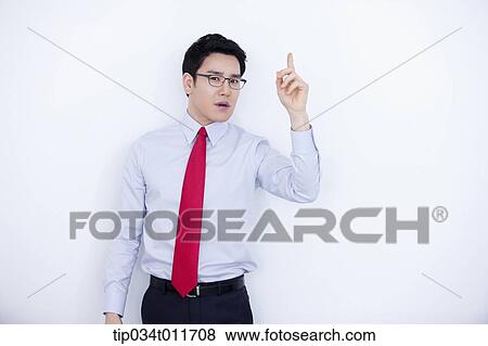 a businessman in business suit explaining using hand gesture View Large Photo Image Stock Photo - a businessman in business suit explaining using hand gesture. Fotosearch