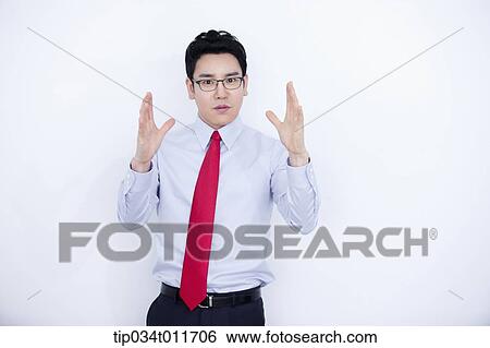 a businessman in business suit explaining using hand gesture View Large Photo Image Stock Photograph - a businessman in business suit explaining using hand gesture. Fotosearch