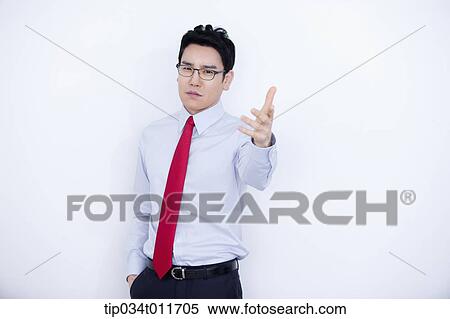a businessman in business suit explaining using hand gesture View Large Photo Image Stock Photography - a businessman in business suit explaining using hand gesture. Fotosearch