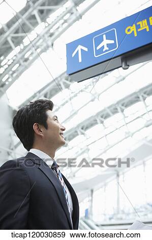a businessman in the airport View Large Photo Image Stock Photo - a businessman in the airport. Fotosearch