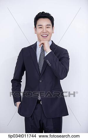 a businessman smiling View Large Photo Image Picture - a businessman smiling. Fotosearch