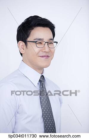a businessman smiling View Large Photo Image Stock Image - a businessman smiling. Fotosearch