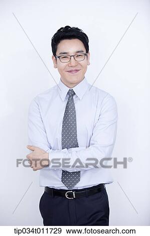 a businessman smiling View Large Photo Image Stock Photo - a businessman smiling. Fotosearch