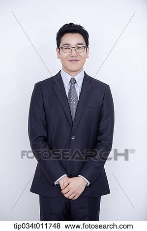 a businessman smiling View Large Photo Image Stock Photo - a businessman smiling. Fotosearch