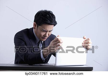 a businessman using a laptop View Large Photo Image Stock Image - a businessman using a laptop. Fotosearch