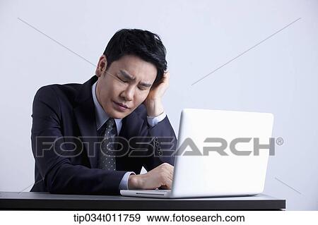 a businessman using a laptop View Large Photo Image Stock Photo - a businessman using a laptop. Fotosearch